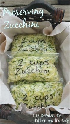 three bags of zucchini sitting on top of a wooden table with the words, preserving zucchini