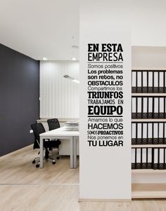 an office with black and white wall decals