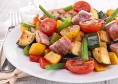 a white plate topped with meat and veggies