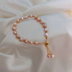 Elevate Your Style With Our Baroque Pink Champagne Pearl Bracelet Featuring An Adjustable Gold Chain. This Exquisite Bracelet Showcases A Series Of Unique Baroque Pearls, Each With An Enchanting Pink Champagne Hue And Organic Shape, Offering A Sophisticated And Modern Look. The Adjustable Gold Chain Ensures A Perfect Fit For Any Wrist Size, Adding A Touch Of Elegance And Versatility. Perfect For Both Casual And Formal Occasions, This Bracelet Adds A Refined Touch To Any Outfit. Each Pearl’s Natu Pink Pearl Bracelet, Pearl Charm Bracelet, Sweet Jewelry, Classic Bracelets, Freshwater Pearl Bracelet, Anniversary Jewelry, Original Jewelry, Natural Pearl, Pearl Charms