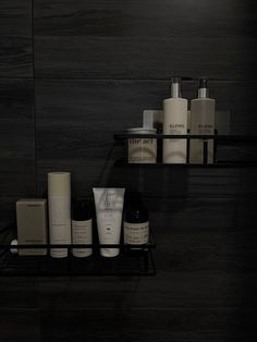 two black shelves filled with different types of skin care products