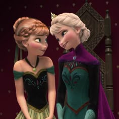 two frozen princesses standing next to each other