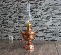 A wonderful nostalgic and romantic lamp that adds a 19th century touch to your home. This Oil Lamp is a nice piece for decoration. The product can be used for decorative purposes. A nice lamp to have in your collection. Copper Oil Lamps one with glass chimney Add a relaxed atmosphere to your room with handmade copper gas lamps which has a dim and flickering light. This unique copper oil lamp, which is completely handmade, will dazzle the viewers in your home and office with its light and workman Gas Lamps, Table Lamp Vintage, Handmade Lamp, Gas Lamp, Lamp Handmade, Flickering Lights, Lamp Vintage, Vintage Lamp, Handmade Lamps