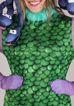 a woman in a green and purple costume