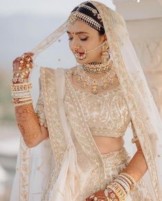 a woman in a bridal outfit with jewelry