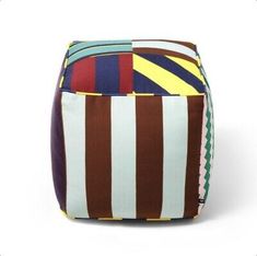 a multicolored striped pouff on a white background