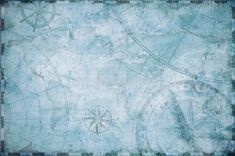 an old grungy blue background with compasses and other things on it's surface