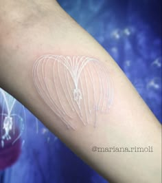 a person with a tattoo on their arm