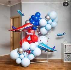 balloons are arranged in the shape of an airplane