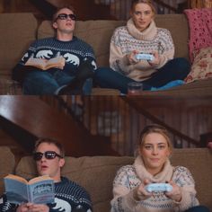 two people sitting on a couch holding remotes and looking at the same person in front of them