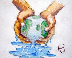 two hands holding a globe in the water