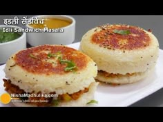 two food items sitting on top of a white plate with sauces in the background