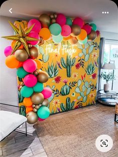 a room decorated with balloons, stars and cactus decorations for a birthday or baby shower