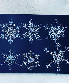 snowflakes are shown on a blue background