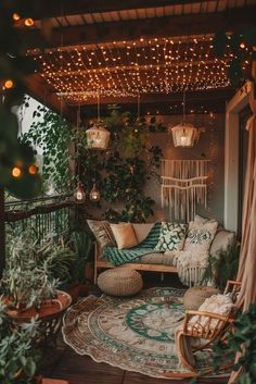 a porch with plants and lights hanging from the ceiling, rugs on the floor