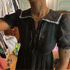 Double Lined Throughout Except For The Sleeves Ties In The Back So Waist Can Be Snatched (Waist Is 28” Untied But Can Be Tied Tighter) Knee Length (The Skirt Is About 26” Long) Brand Is “Laura Ashley Mother And Child” So I Think Potentially A Child Size Lmao But Definitely Can Fit On A Xs Or Xxs Would Recommend For Smaller Busts As The Button Up Front Pulls With A 32” Bust Made In The Uk 100% Cotton In Great Condition But It’s Top Button Is Missing However There’s A Spare Button On The Card Tag So It Can Easily Be Replaced If You’re A Girlie Who Also Accidentally Acquires Vintage Children Dresses This One Fits Very Well Overall Snatched Waist, Laura Ashley Dress, Ashley Black, Sailor Collar, White Ribbon, Laura Ashley, Mother And Child, Small Bust, Vintage Children