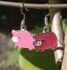 A pair of pink pig charm earrings measuring about 1/2 inch tall and 3/4 inch wide.  Drop length is about 1 inch.  Pain, flat backs and Lightweight! Charm Earrings, Jewelry Earrings Dangle, 1 Inch, 4 Inch, Etsy Earrings, Dangle Drop Earrings, Dangle Earrings, Jewelry Earrings, Personalized Items