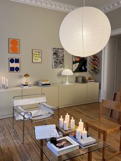 a living room filled with furniture and candles