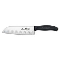 a large knife with a black handle on a white background