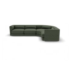 a green sectional couch sitting on top of a white floor