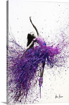 a woman with purple paint on her body and arms is flying through the air in front of a white background