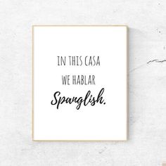 a black and white poster with the words in this casa we hablaar spanish