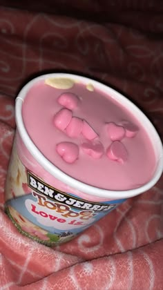 a pink yogurt with gummy bears in it