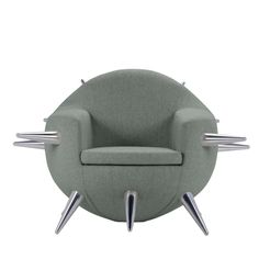 a grey chair with chrome legs and an armrest that is shaped like a circle