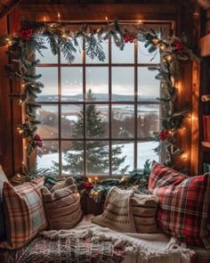 a living room filled with lots of furniture and christmas decorations on the window sill