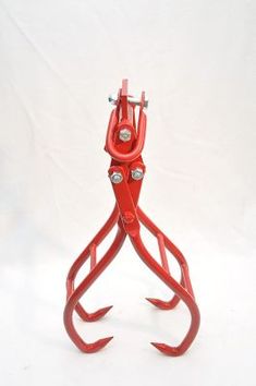 a pair of red pliers on a white background