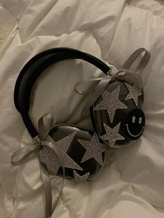 a pair of headphones laying on top of a bed