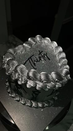 there is a cake that has been decorated with the word tatt on it,