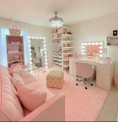 a bedroom with pink furniture and lots of lights