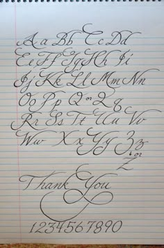 a notepad with writing on it and the words thank you written in cursive ink