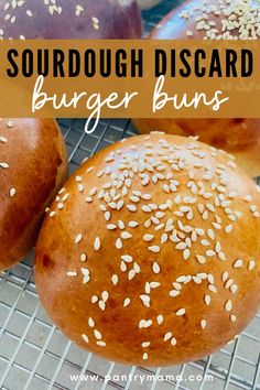 hamburger buns on a cooling rack with text overlay saying sourdough discard burger buns