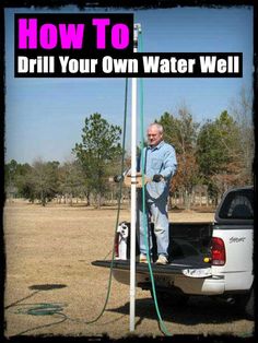 a man standing on the back of a truck with a water hose attached to it