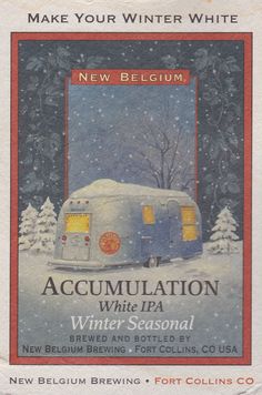 an advertisement for the new belgum winter white beer, with a trailer in the snow