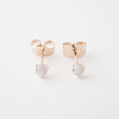 A pair of delicately set, tiny Opal crystal stud earrings. Gorgeous when worn alone or alongside your favorite studs. Opal is a beautiful gemstone with a subtle metallic rainbow-like gemstone. It's known to inspire love, hope, luck, and happiness in one's life. These measure in at a tiny 3 mm. Our materials make for an amazing, high quality, seamless, jewelry piece with longevity. Our earrings are plated with 18k gold, 18k rose gold, or rhodium and finished with a protective coating. A little se Delicate Gold Jewelry, Metallic Rainbow, Daisy Studs, Solitaire Studs, Bow Jewelry, Crystal Stud Earrings, Delicate Jewelry, Star Studs, Accessories Jewelry Earrings