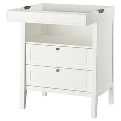 a white cabinet with two drawers on the bottom and one drawer at the top that is open