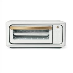 a white toaster oven sitting on top of a counter