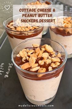 three desserts in small bowls with nuts and peanut butter on top, sitting on a table