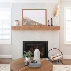 a living room filled with furniture and a fire place in front of a painting on the wall