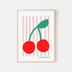 two cherries on a pink and white striped background with the word cherries written in red