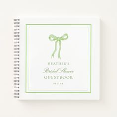 a wedding guest book with a green bow on the front and back cover that reads, leather's bridal heaven guestbook