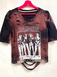 Ramones reworked one of a kind sweatshirt. Bleached and over dyed sweatshirt with puffy shoulders. Half length sleeves. Distressed front and back. Snap tape detailing on the hem. Slashed open back. Size Medium Spring Streetwear Hand Dyed Tops, Spring Hand Dyed Tops For Streetwear, Acid Wash Punk Style Tops, Fall Streetwear Bleached Tops, Hand Dyed Grunge Tops For Streetwear, Grunge Hand Dyed Tops For Streetwear, Punk Cotton Sweatshirt, Distressed Edgy Tops For Fall, Edgy Washed Tops For Fall