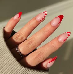 Red Love Heart Acrylic Nails, Valentines Nails Red Tips, Red Nail Designs With Heart, Red French Tip Nails With Heart Design, Red French Tip Nails Almond With Heart, Red French Nails With Heart, Red Heart Tip Nails, Red Tip Oval Nails, Red French With Heart