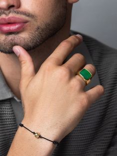 Hypoallergenic Stainless Steel Ring with 18K Gold Plating Eco-conscious Engraved detailing Green Agate Stone Product Code: MRING_188 Designer's Notes The Nialaya Gentlemen's Gold-Polished Signet Ring embodies modern sophistication with a refined edge. At its center, a polished Green Agate stone adds a vibrant touch, beautifully complemented by intricate engraved detailing on the gold-polished band. Crafted from durable stainless steel with a sleek gold finish, this signet ring is a striking acce Gold Signet Ring, Raffia Bag, Stainless Steel Ring, Onyx Bead, Green Agate, Engraved Logo, Jade Stone, Gold Plated Rings, Metallic Bag