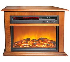 an electric fireplace heater with logs and flames