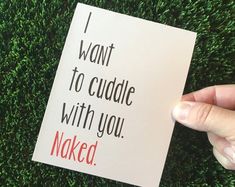 someone holding up a card that says i want to cuddle with you naked