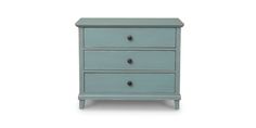 a blue dresser with three drawers on it's sides and one drawer open to the side